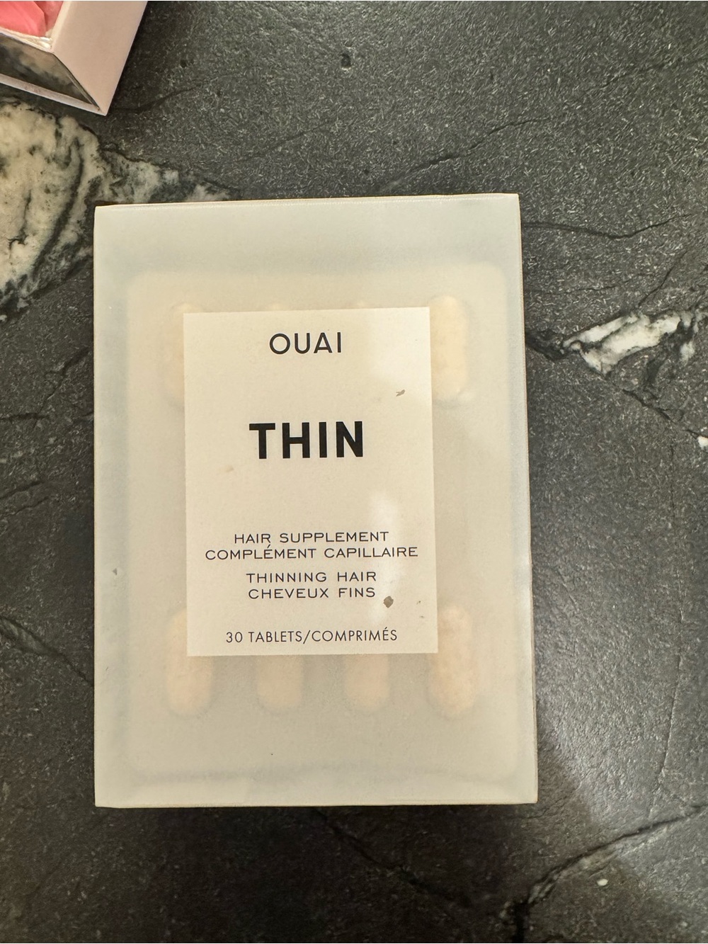 OUAI Thin Hair Supplement - Cream and Black Packaging